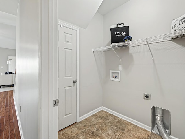 clothes washing area featuring laundry area, hookup for a washing machine, baseboards, and electric dryer hookup