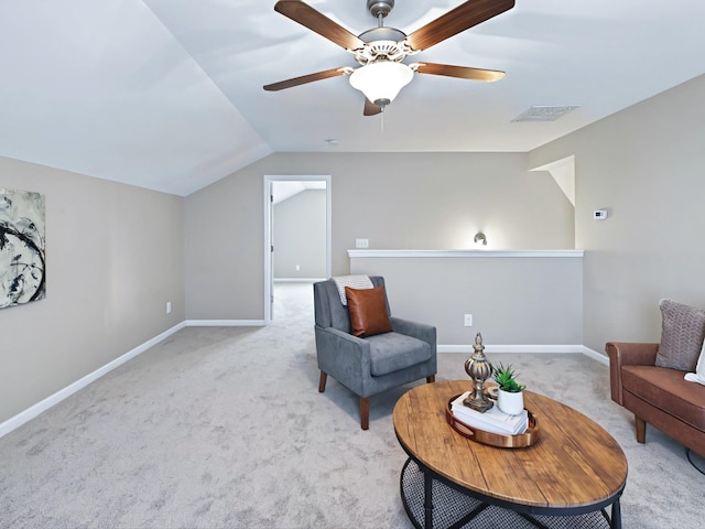 sitting room featuring baseboards, visible vents, vaulted ceiling, and carpet flooring