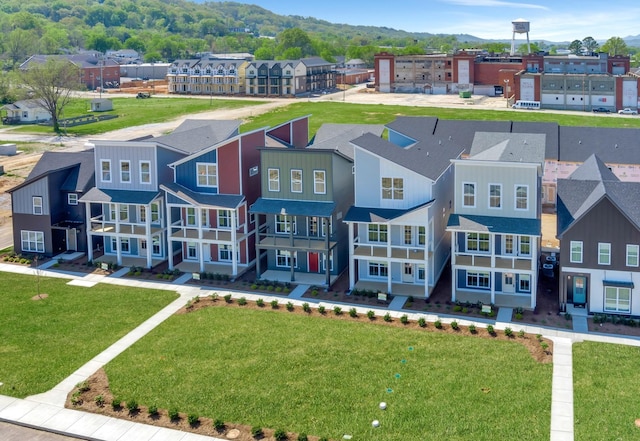 birds eye view of property with a residential view