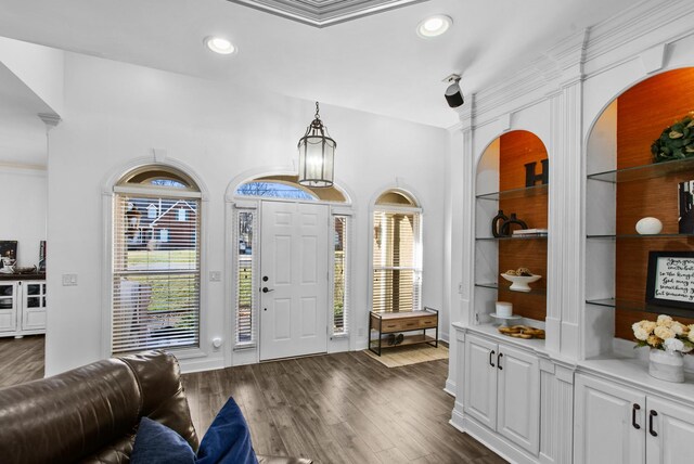 entryway with dark wood-style floors and recessed lighting