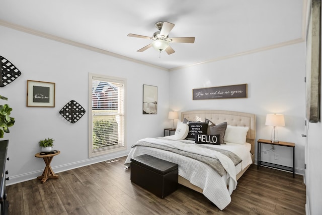 bedroom with dark wood-style floors, ornamental molding, a ceiling fan, and baseboards