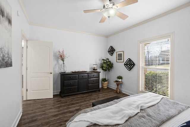 bedroom with baseboards, ornamental molding, dark wood finished floors, and a ceiling fan