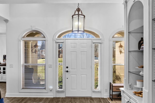 foyer entrance featuring wood finished floors