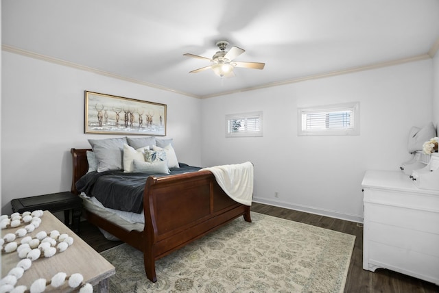 bedroom featuring baseboards, ceiling fan, dark wood finished floors, and crown molding