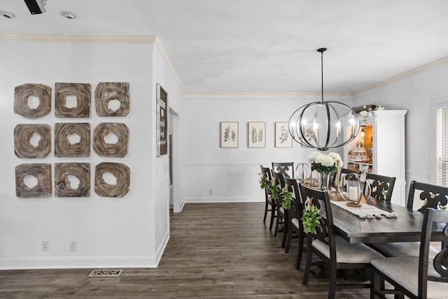 dining space featuring a chandelier, dark wood finished floors, and crown molding