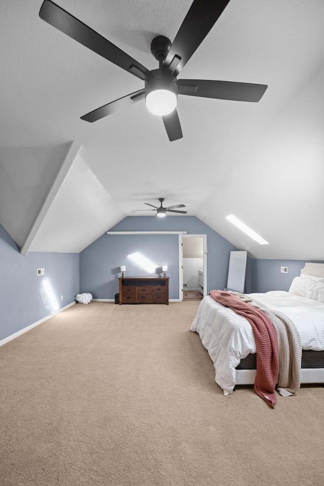 carpeted bedroom featuring lofted ceiling, ceiling fan, and baseboards