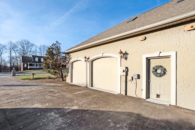 garage featuring driveway