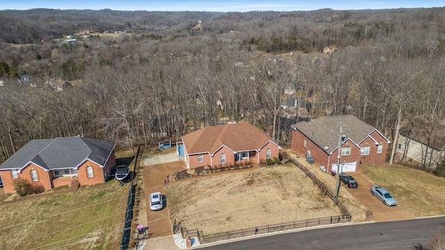 drone / aerial view with a view of trees