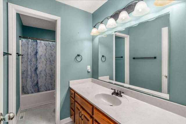 bathroom with shower / bath combination with curtain, visible vents, vanity, and baseboards