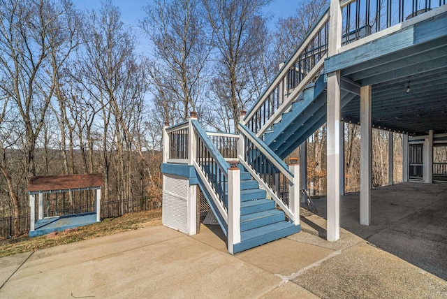 view of side of property with stairway