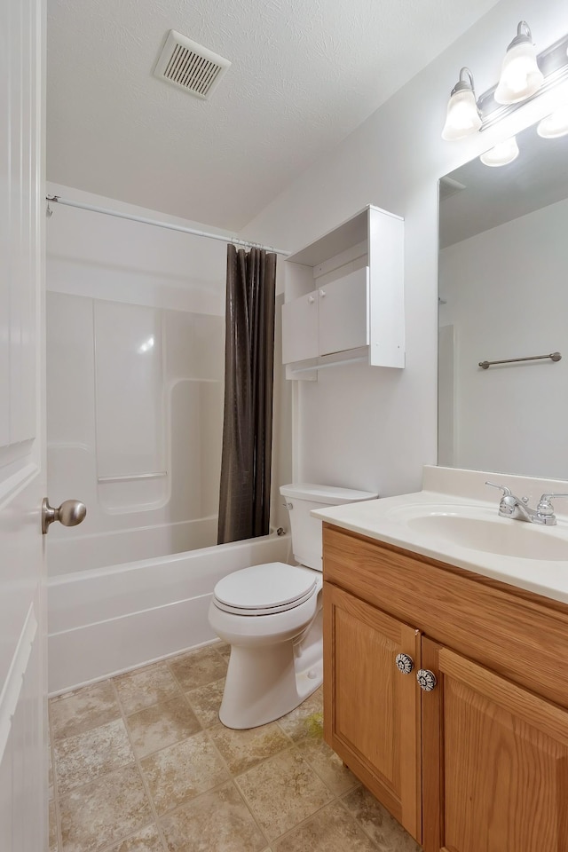 bathroom featuring shower / bath combo, visible vents, vanity, and toilet