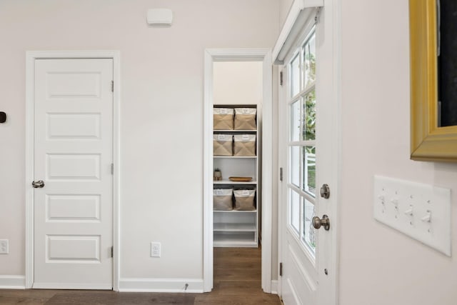 interior space with dark wood finished floors and baseboards