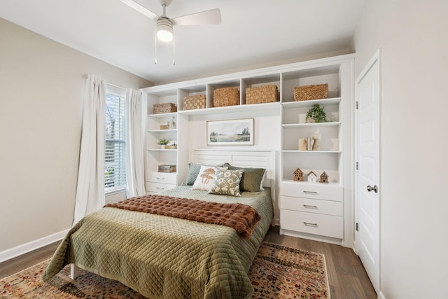 bedroom featuring dark wood-style floors, baseboards, and a ceiling fan