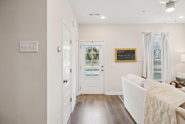 entryway with baseboards, visible vents, a ceiling fan, wood finished floors, and recessed lighting