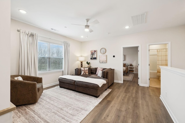 bedroom featuring recessed lighting, wood finished floors, visible vents, and baseboards