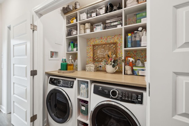 laundry area with laundry area and separate washer and dryer