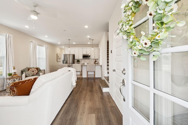 living room featuring dark wood-style floors, recessed lighting, and a ceiling fan