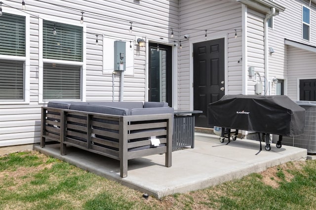 view of patio / terrace with a grill and a jacuzzi