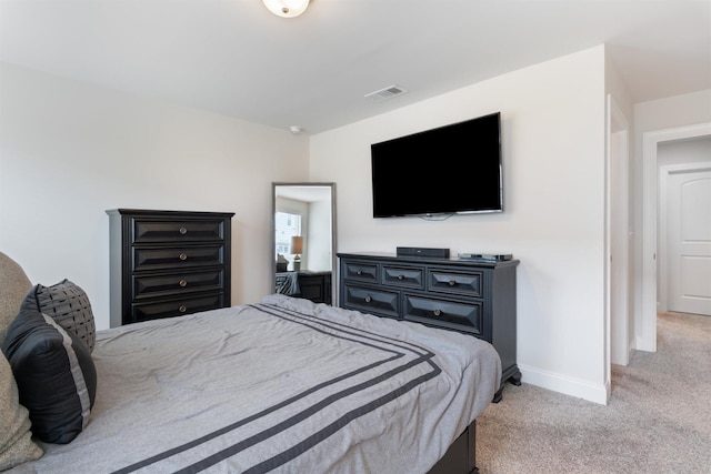 bedroom featuring light carpet, baseboards, and visible vents