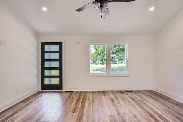 foyer with recessed lighting, baseboards, and light wood finished floors