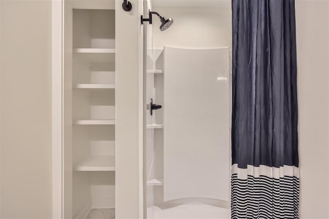 bathroom with a shower with shower curtain