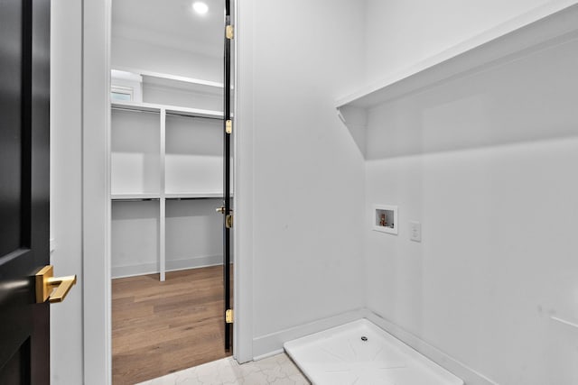 laundry room featuring hookup for a washing machine, laundry area, and wood finished floors