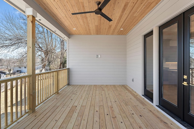 wooden deck featuring a ceiling fan