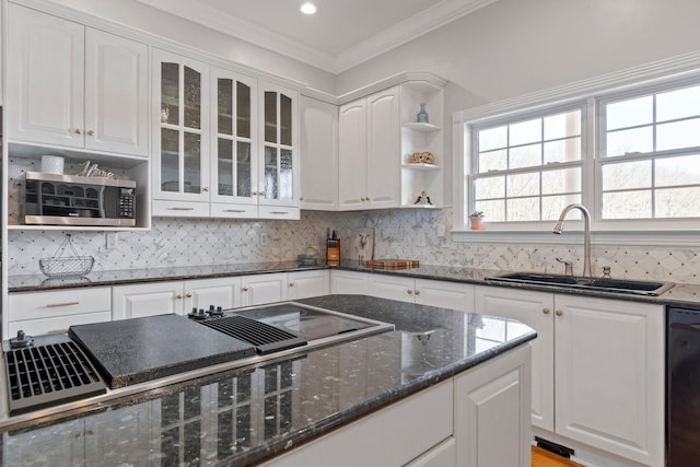 kitchen featuring ornamental molding, white cabinetry, a sink, and black appliances