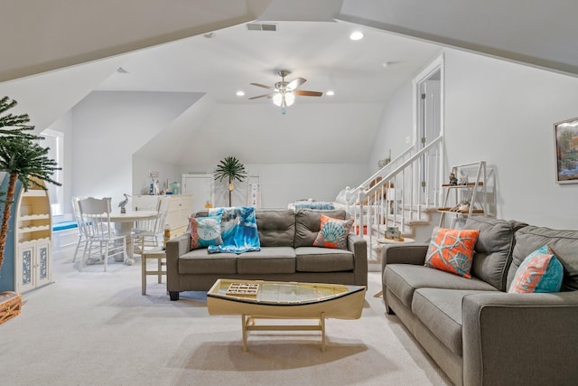 carpeted living room with ceiling fan, recessed lighting, visible vents, vaulted ceiling, and stairway