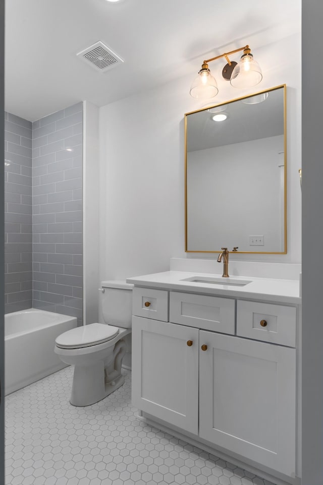 full bathroom featuring toilet, tile patterned flooring, vanity, and visible vents