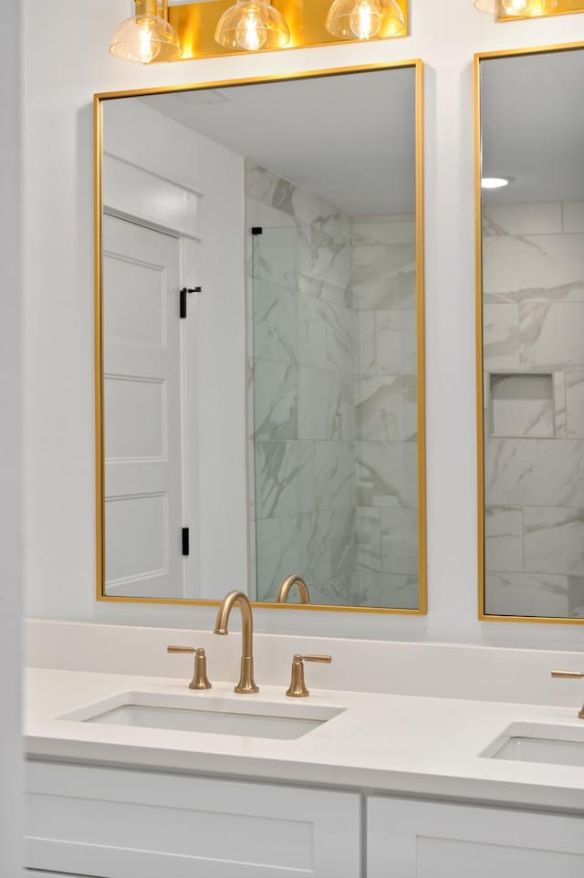 full bathroom featuring double vanity and a sink