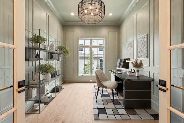 home office featuring a chandelier, recessed lighting, a decorative wall, wood finished floors, and ornamental molding