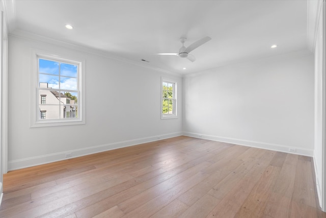 empty room featuring ceiling fan, recessed lighting, baseboards, ornamental molding, and light wood finished floors