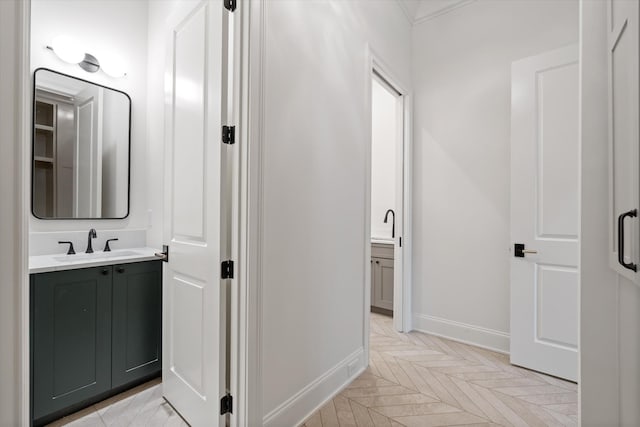 bathroom with vanity and baseboards