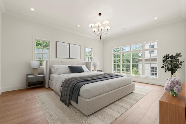 bedroom with recessed lighting, an inviting chandelier, ornamental molding, light wood-type flooring, and baseboards