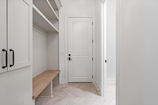 mudroom featuring baseboards