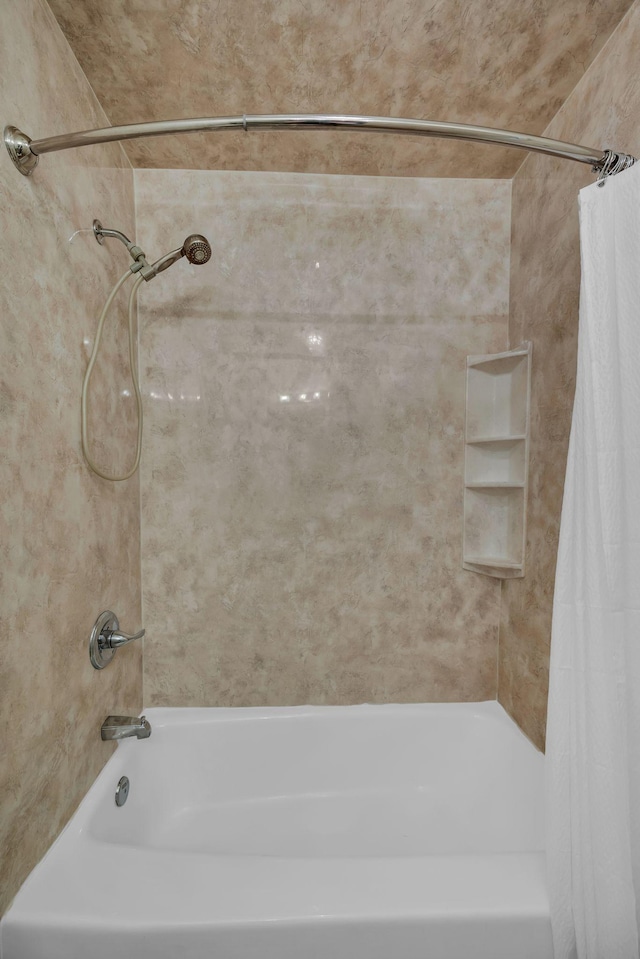 bathroom with shower / tub combo with curtain