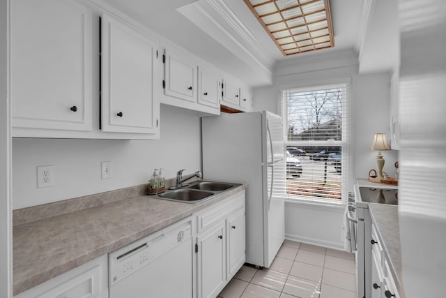 kitchen with a healthy amount of sunlight, white appliances, crown molding, and a sink