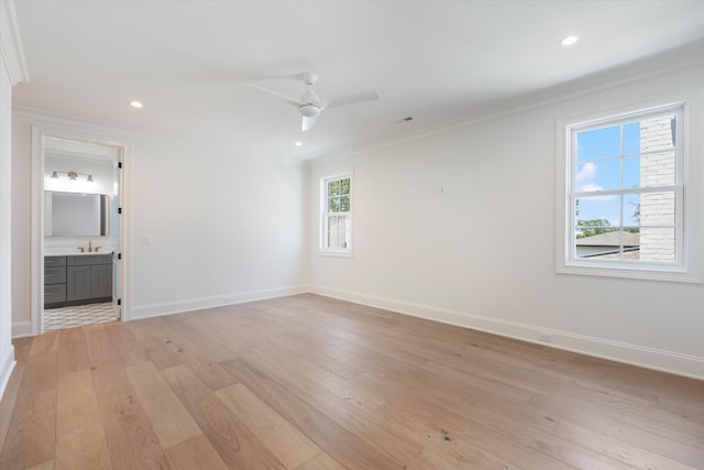 unfurnished room featuring recessed lighting, a ceiling fan, baseboards, light wood-style floors, and crown molding