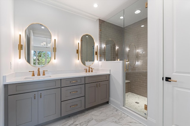 full bath with marble finish floor, ornamental molding, a stall shower, and a sink