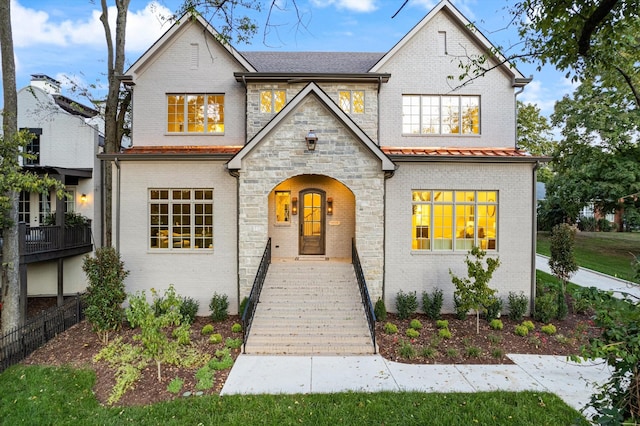 view of front of house featuring stone siding and brick siding