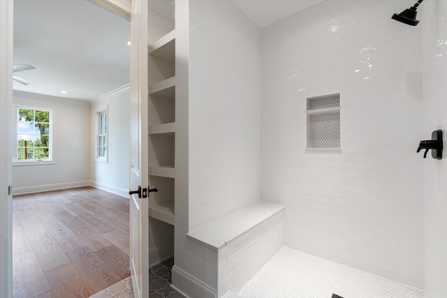 mudroom featuring baseboards, wood finished floors, and crown molding