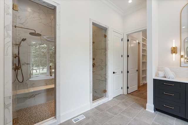 bathroom with vanity, visible vents, a marble finish shower, a walk in closet, and crown molding