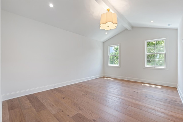 unfurnished room with vaulted ceiling with beams, light wood-style flooring, baseboards, and recessed lighting