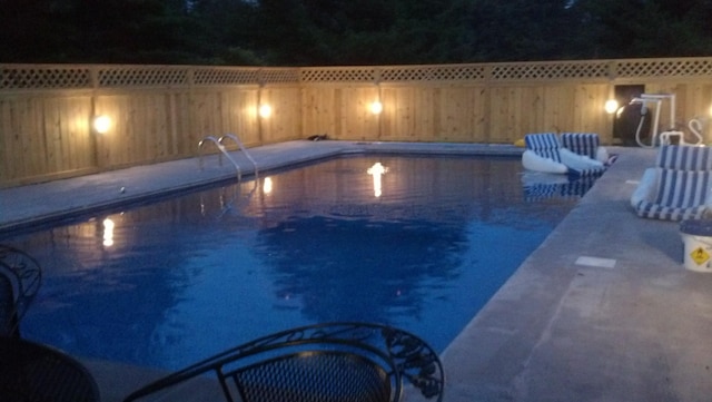 view of swimming pool featuring a fenced in pool and a fenced backyard