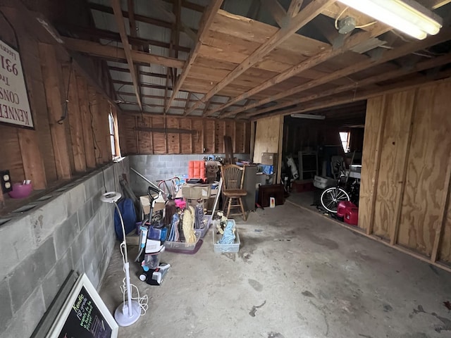 garage with concrete block wall