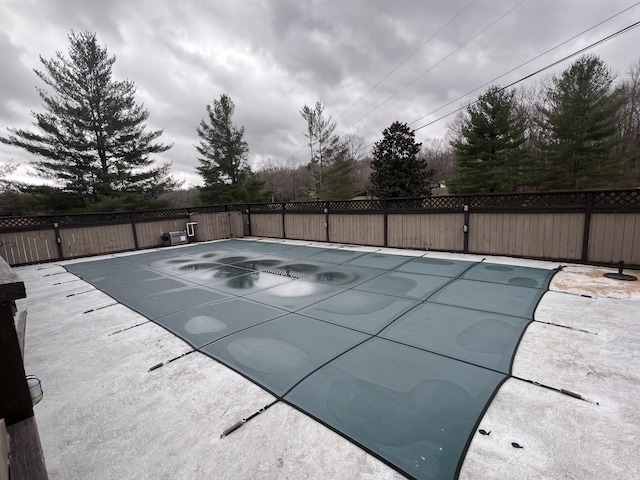 view of pool with a patio area, fence, and a fenced in pool