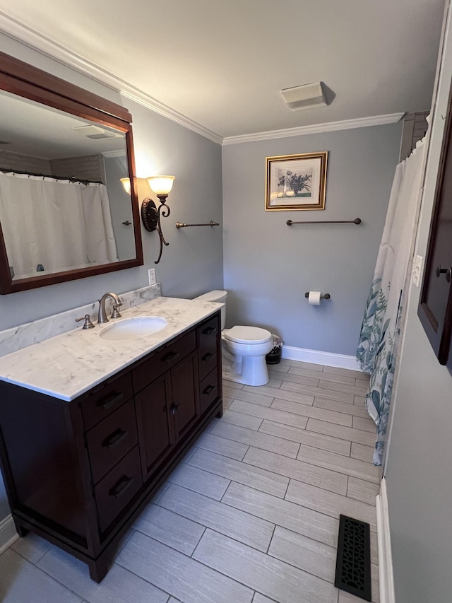 bathroom with toilet, visible vents, crown molding, and vanity