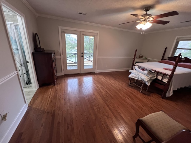 bedroom featuring dark wood-type flooring, visible vents, access to exterior, ornamental molding, and french doors