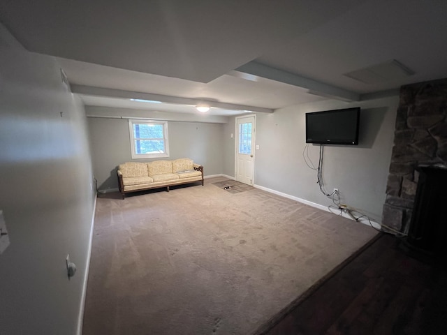 unfurnished living room with carpet and baseboards